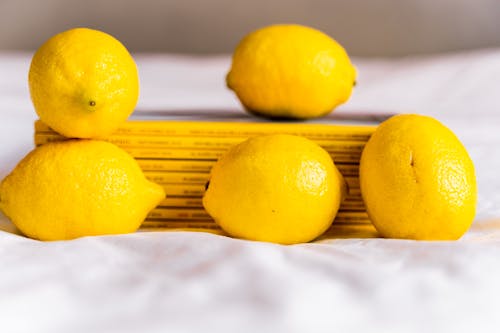 Fresh yellow lemons on table