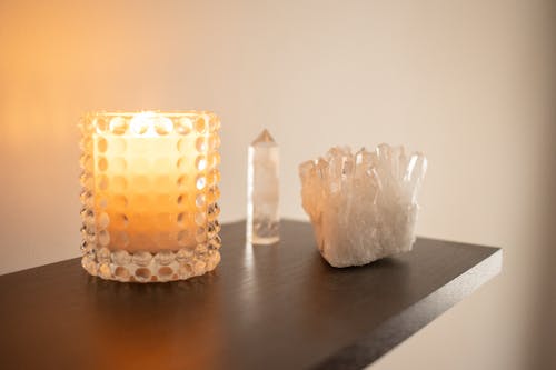 Free Lighted Candle on the Wooden Shelf Stock Photo