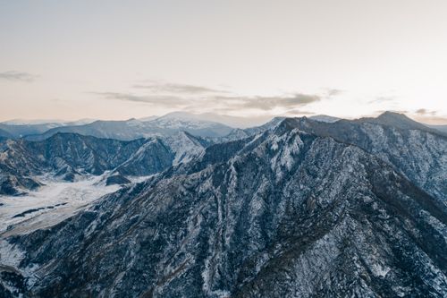 Free Stunning aerial view of the snow-covered Altai Mountains under a crisp clear sky. Stock Photo