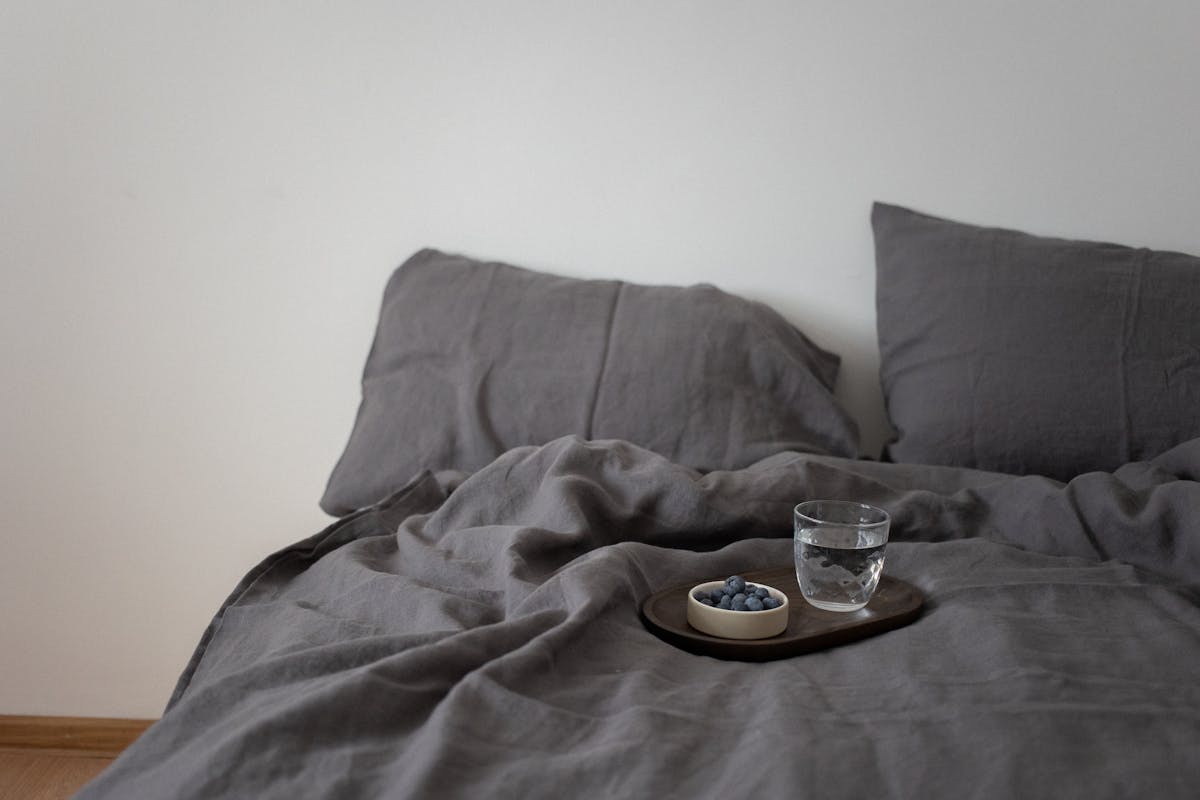 A Glass of Water on the Bed