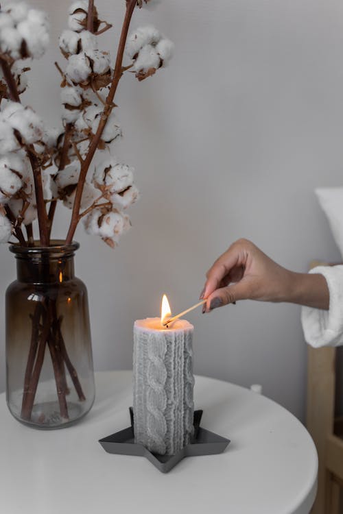 Free Close-Up Shot of a Person Lighting a Candle Stock Photo