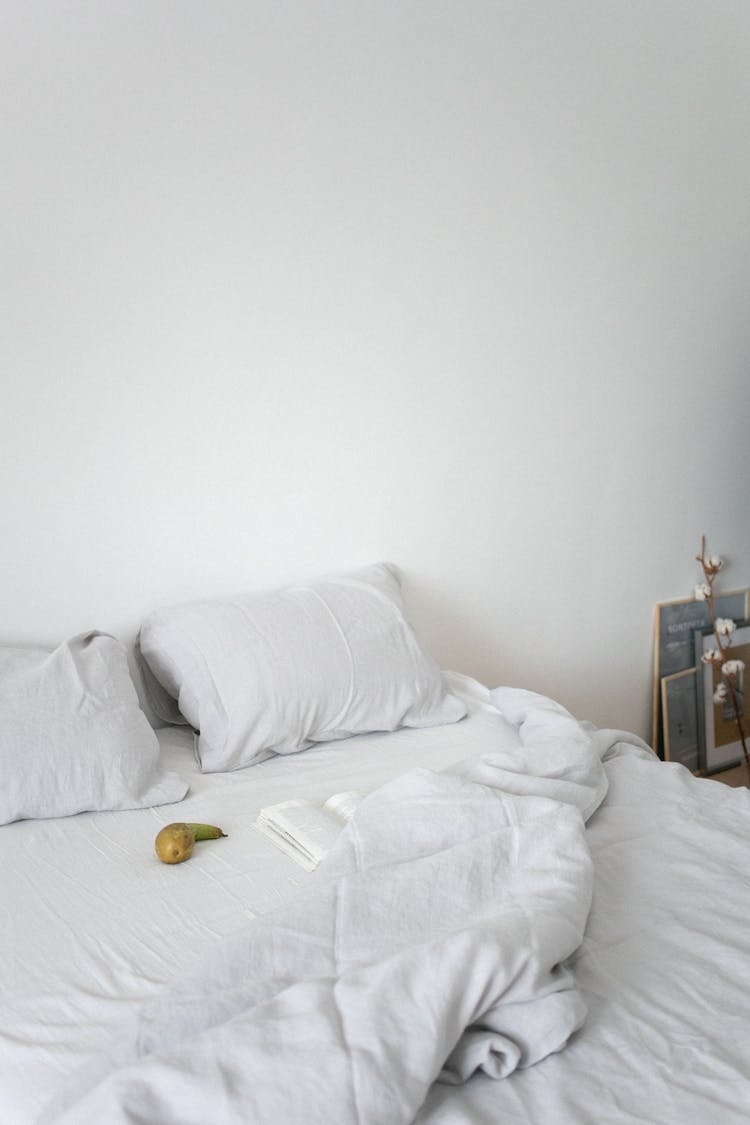 White Pillows On The Bed