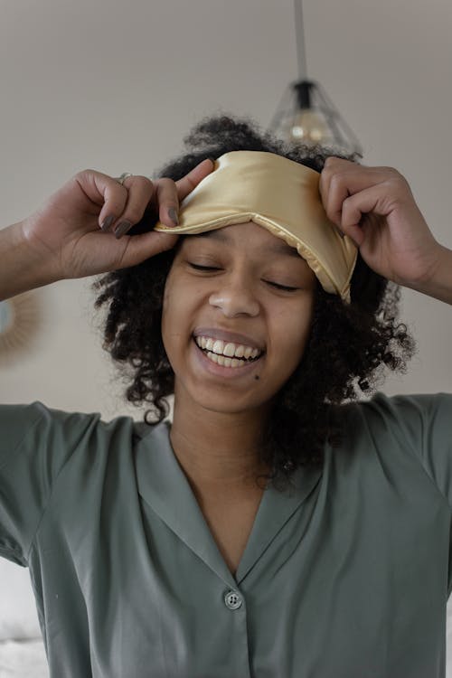 Free Close-Up Shot of a Woman Waking Up from Sleep Stock Photo