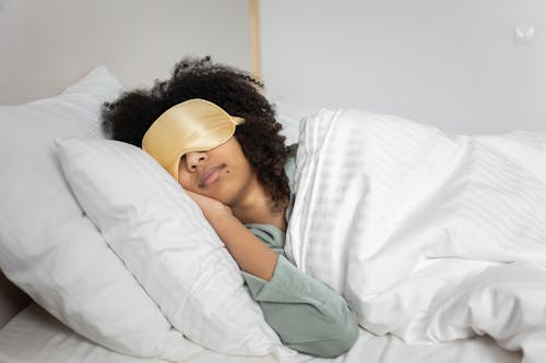 Free A Woman Sleeping on the Bed Stock Photo