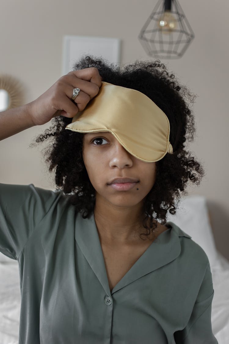 A Woman Holding Sleep Mask