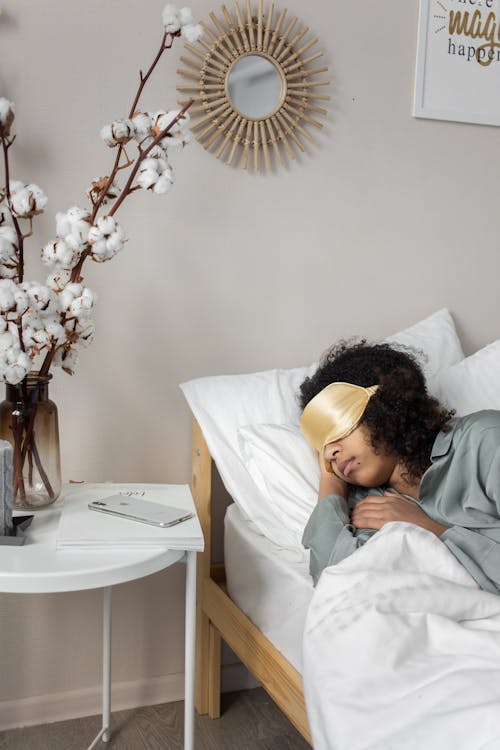 Free A Woman Sleeping on the Bed Stock Photo