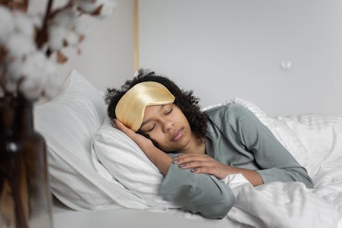 Free A Woman Sleeping on the Bed Stock Photo