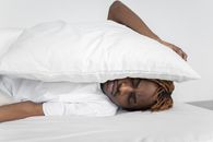 White Pillow on Top of a Man