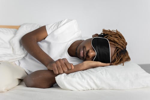 Free Photo of a Man with a Black and White Sleep Mask Stock Photo