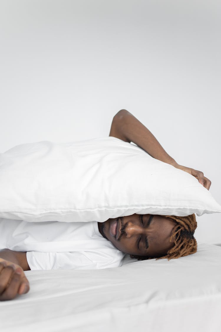 Man Sleeping On The Bed On White Background