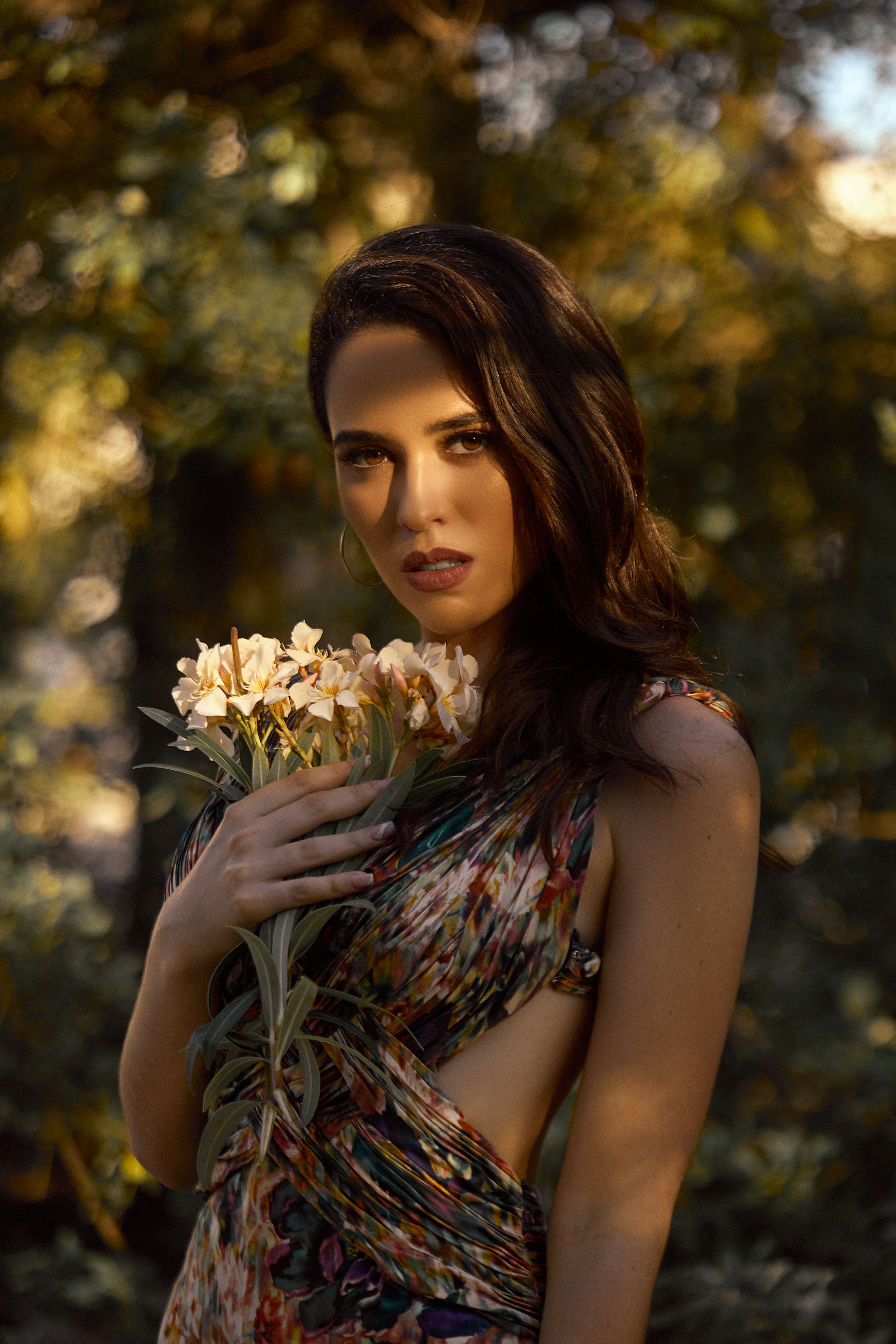 A Woman Holding a Bouquet of Flowers · Free Stock Photo