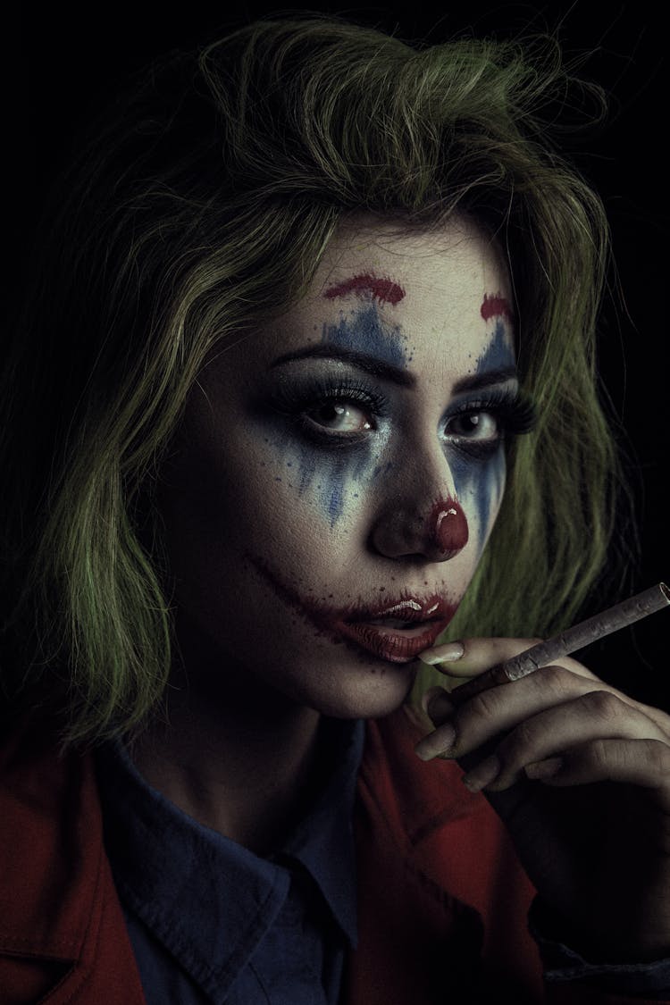 A Woman Cosplaying As Joker