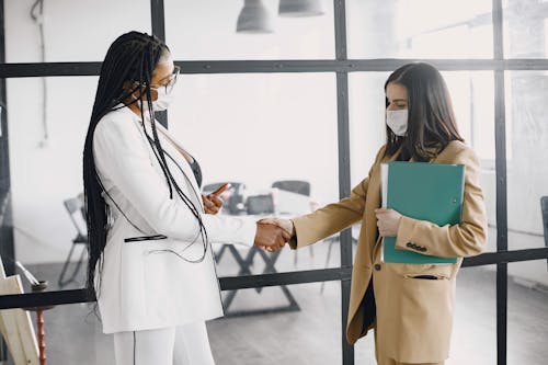 Photograph of Women Doing a Handshake