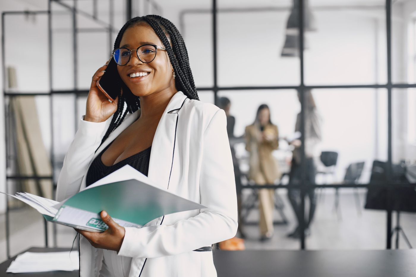Black woman reviewing financial documents and credit information