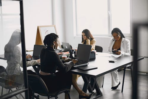 Women Sitting at the Office Table