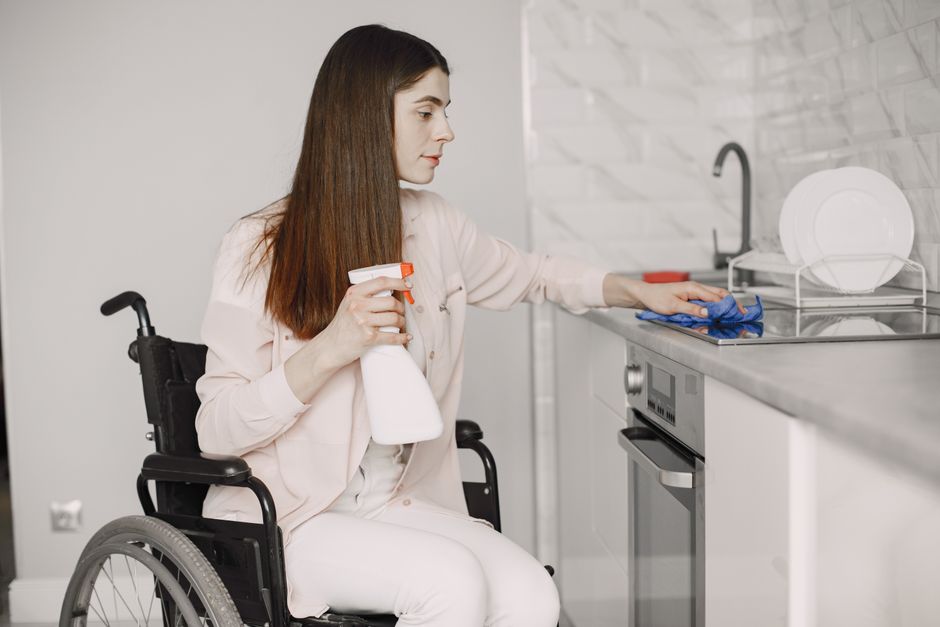 A wheelchair-accessible kitchen with lowered countertops and wide turning spaces A wheelchair-accessible kitchen with lowered countertops and wide turning spaces
