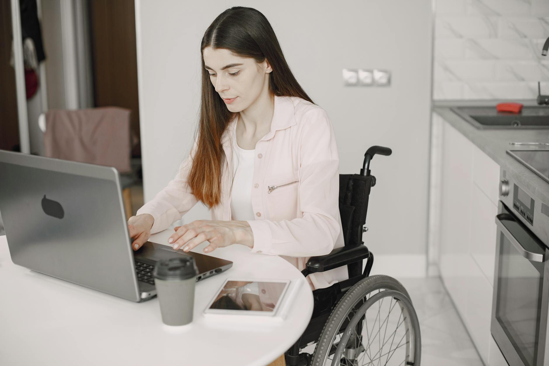 A Woman on a Wheelchair Working