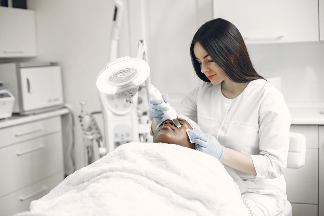 Free Woman Getting a Facial Treatment Stock Photo