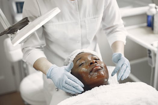 A client enjoys a soothing facial treatment in a modern skincare clinic, promoting wellness and relaxation.