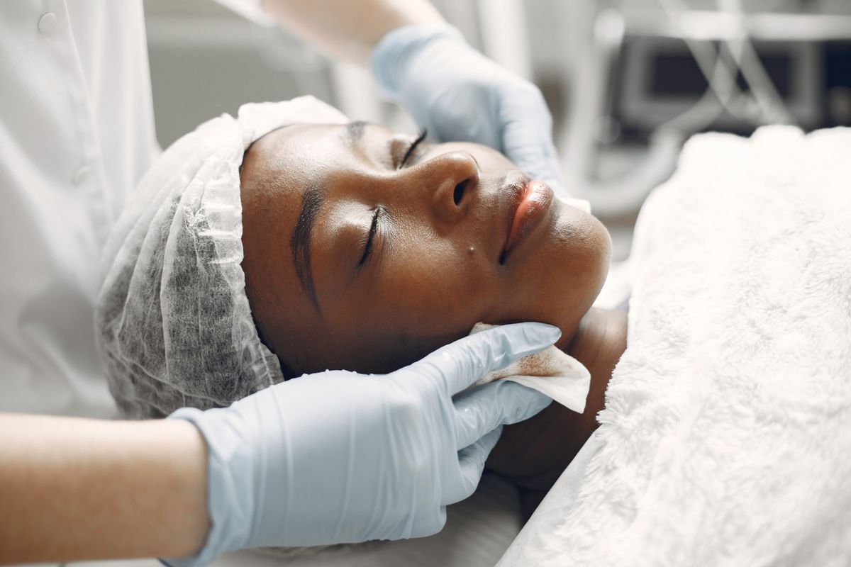 Close-up of a client enjoying a calming, non-invasive cosmetic facial treatment.