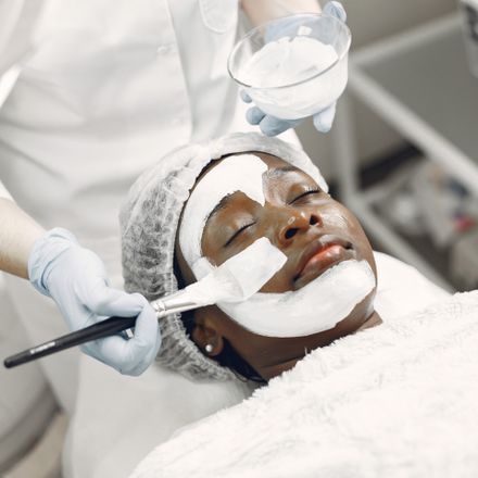 Client resting during a facial mask treatment