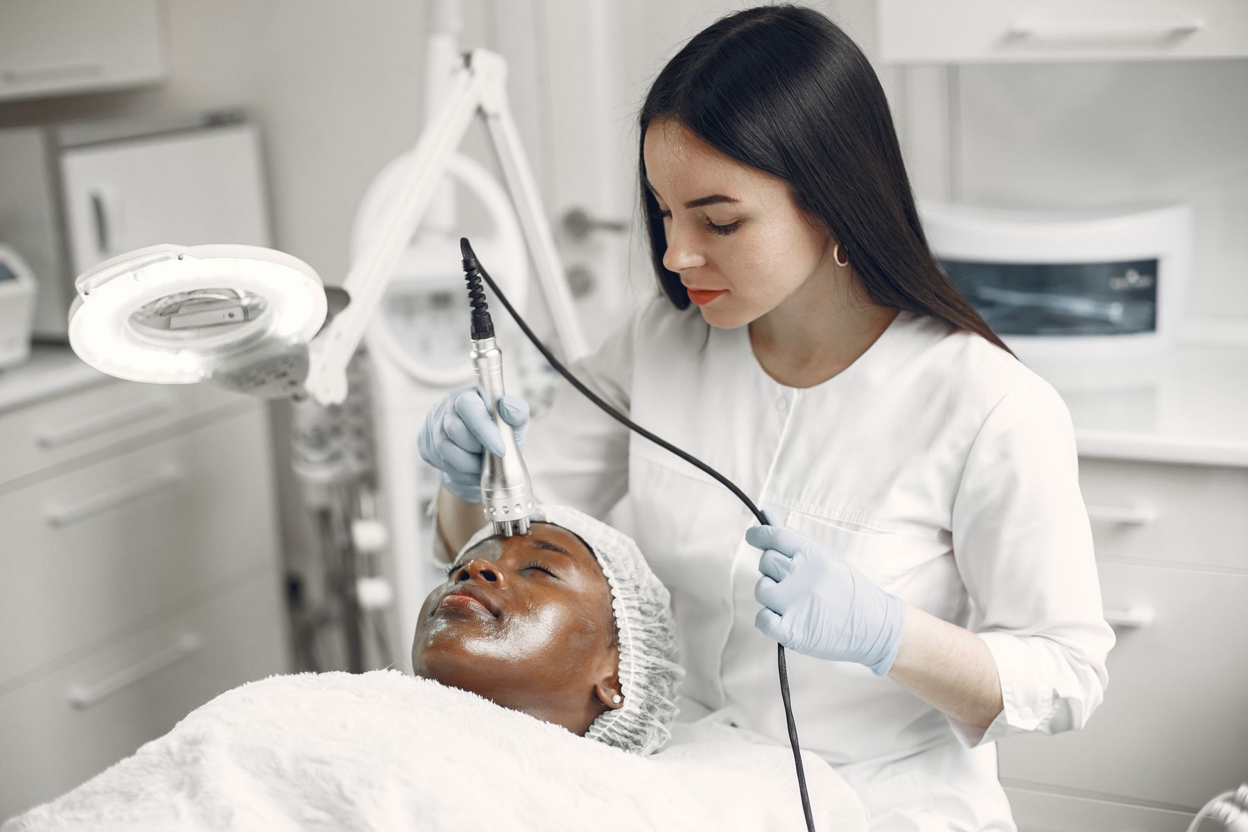 Dermatologist providing personalised skin care in a modern clinical setting