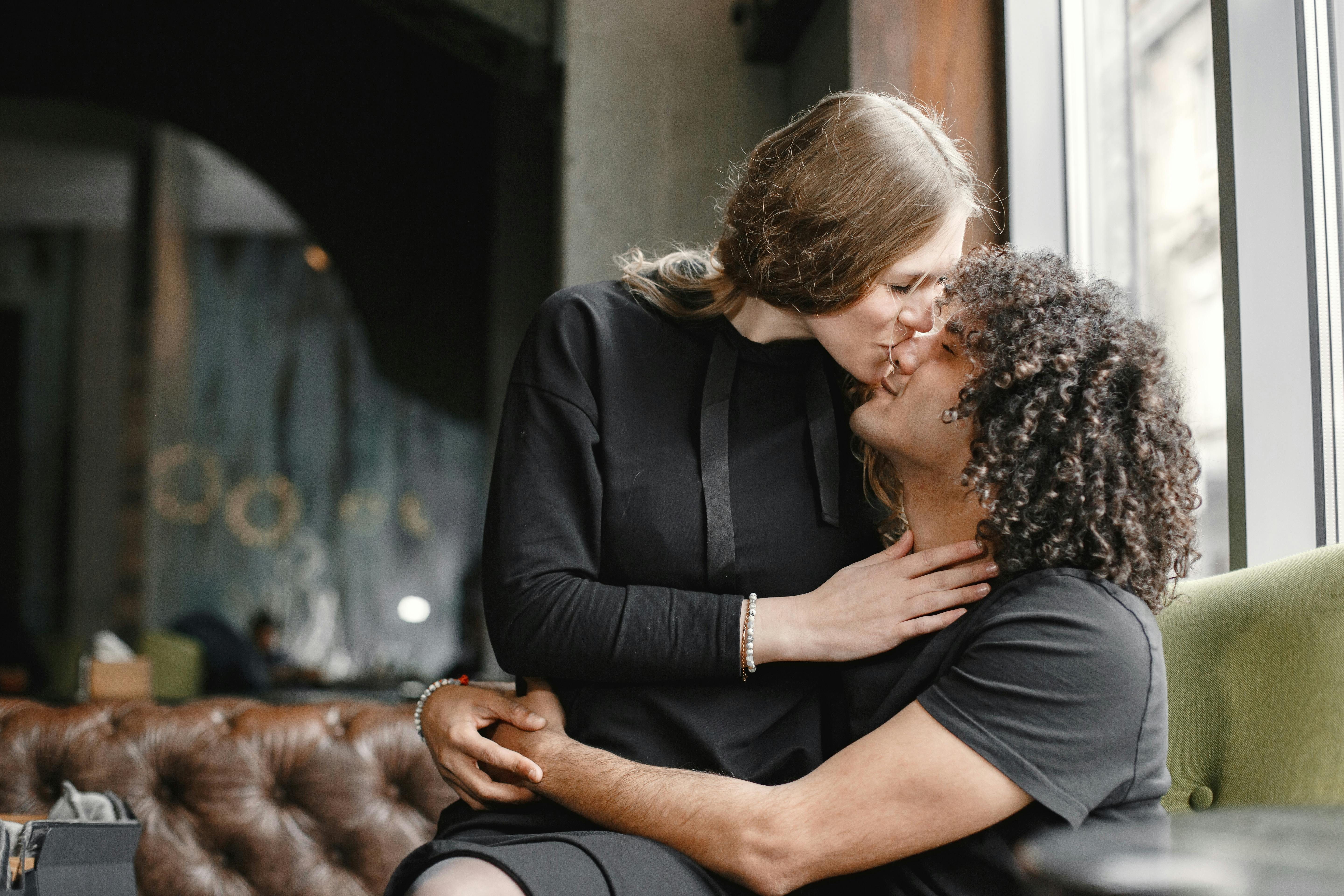 Girlfriend Sitting on Her Boyfriends Lap and Kissing Him on the Tip of His  Nose · Free Stock Photo