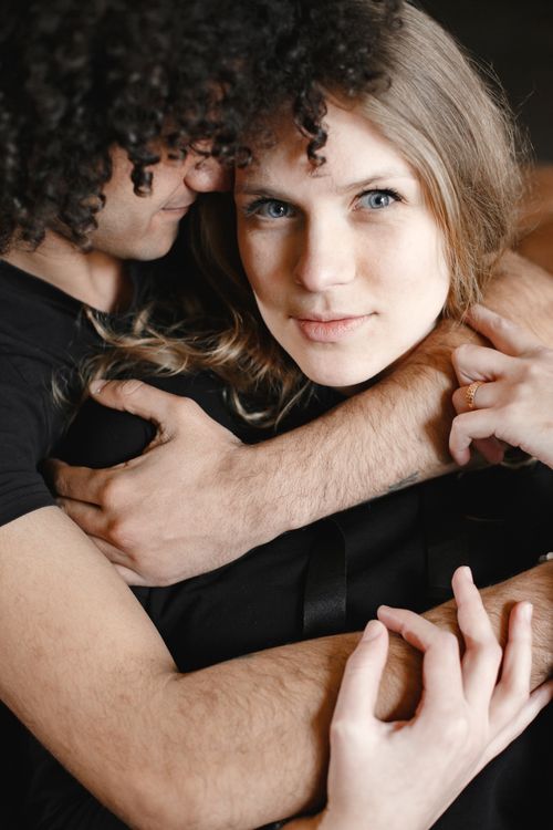 Free A couple sharing a tender embrace, reflecting deep affection and intimacy. Stock Photo