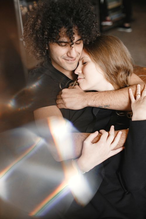 Free A young couple sharing a tender embrace, exuding warmth and togetherness. Stock Photo