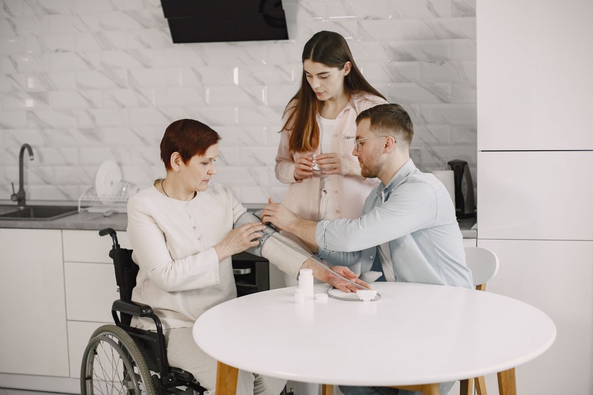 Family monitoring blood pressure at home