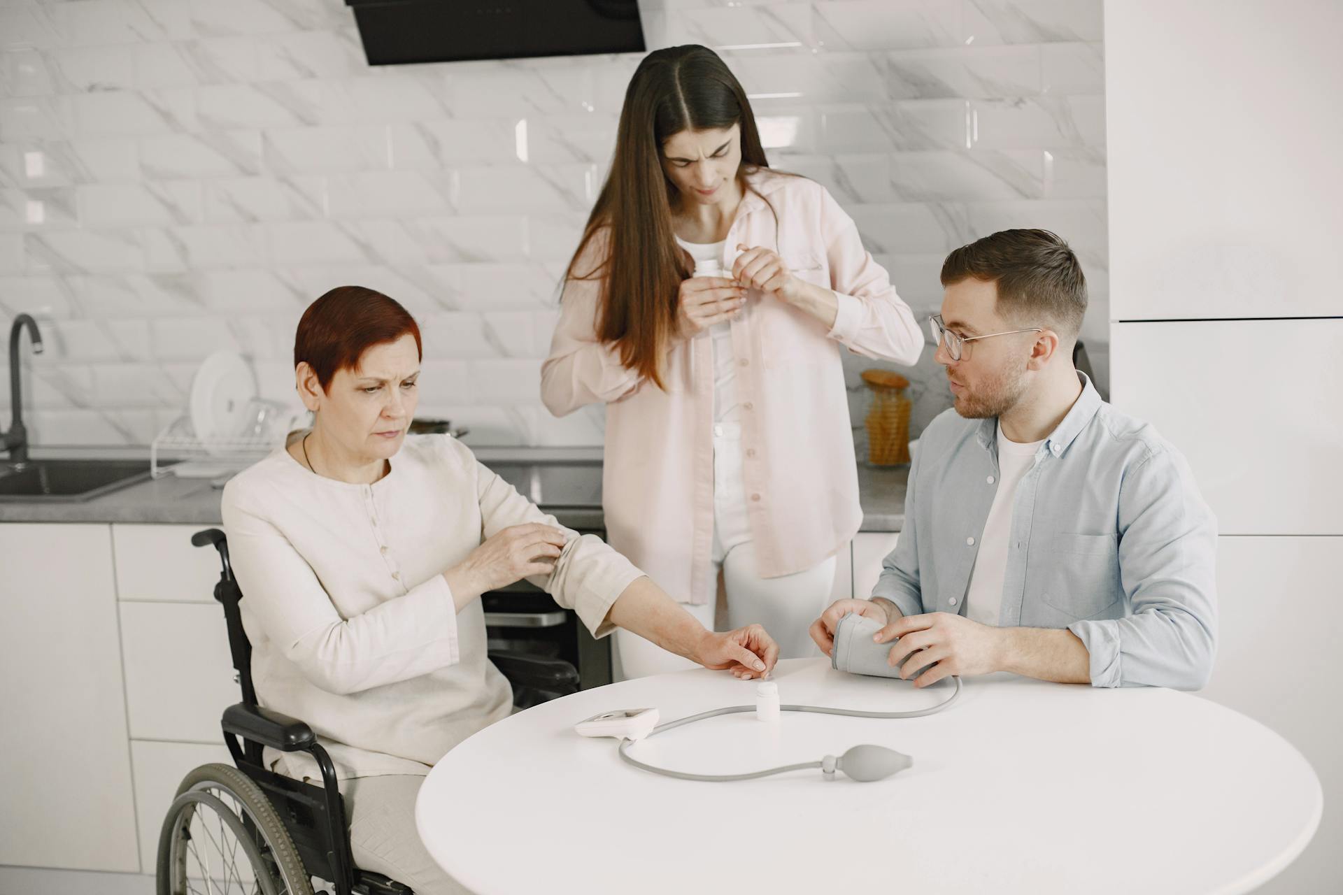 A family assists in measuring blood pressure at home, promoting healthcare awareness.