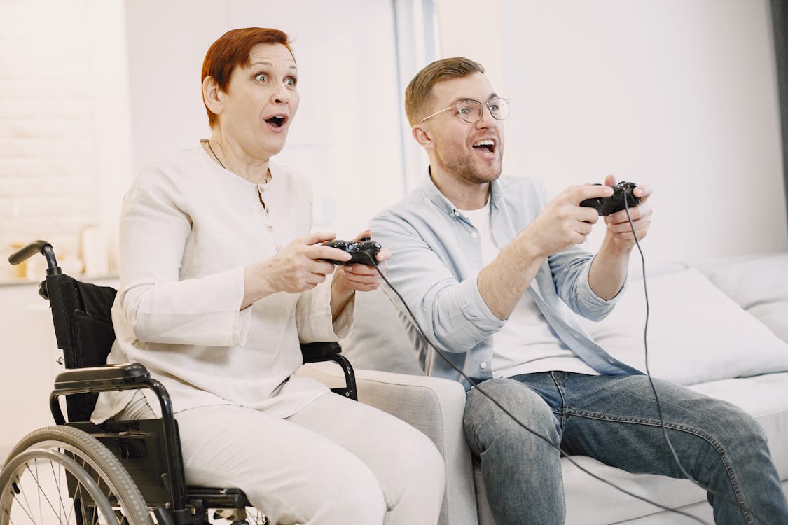 Man And Woman Playing Video Games Stock Photo