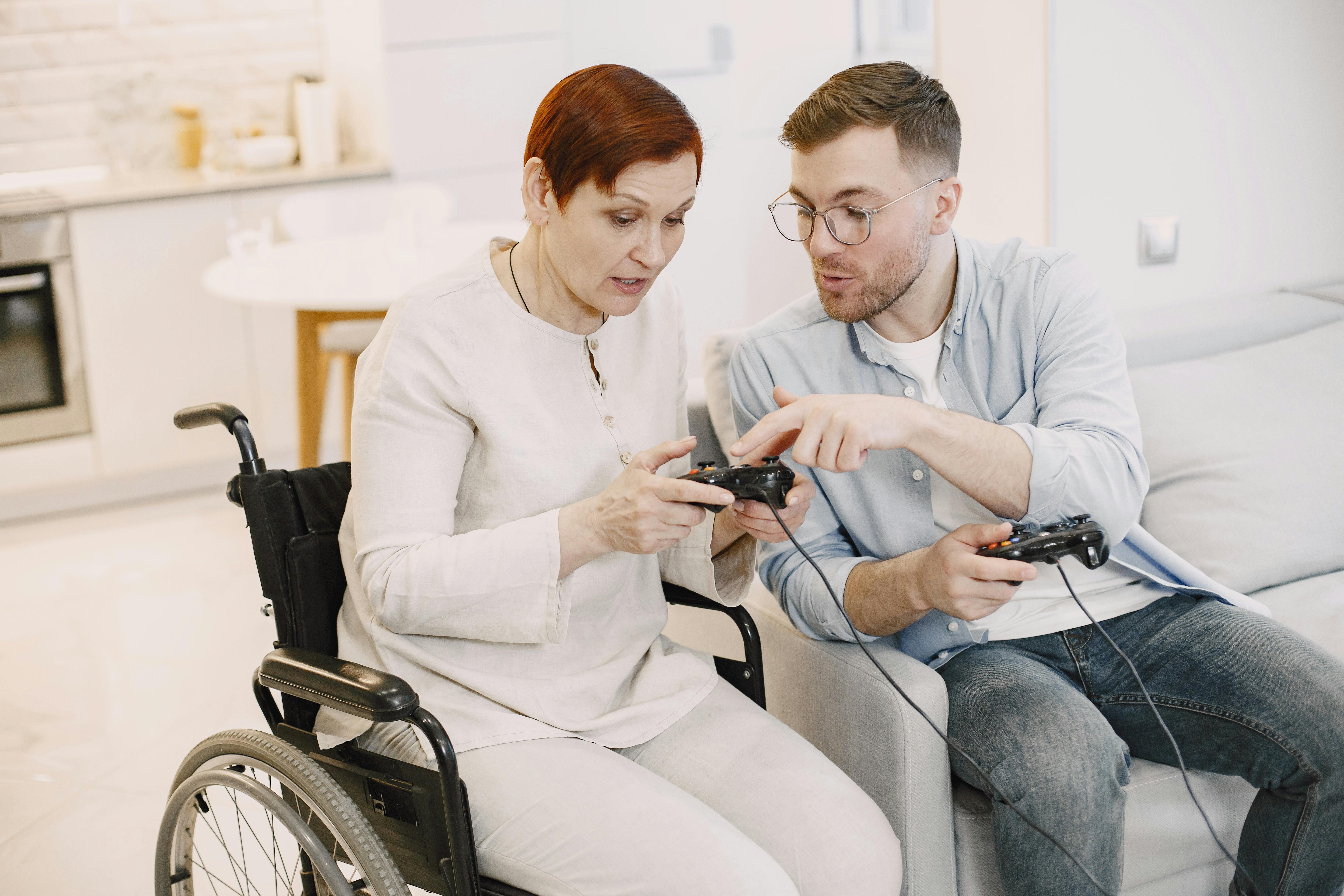 man and woman using game controllers