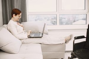 Woman smiling during a video call — Gustavo Fring on Pexels