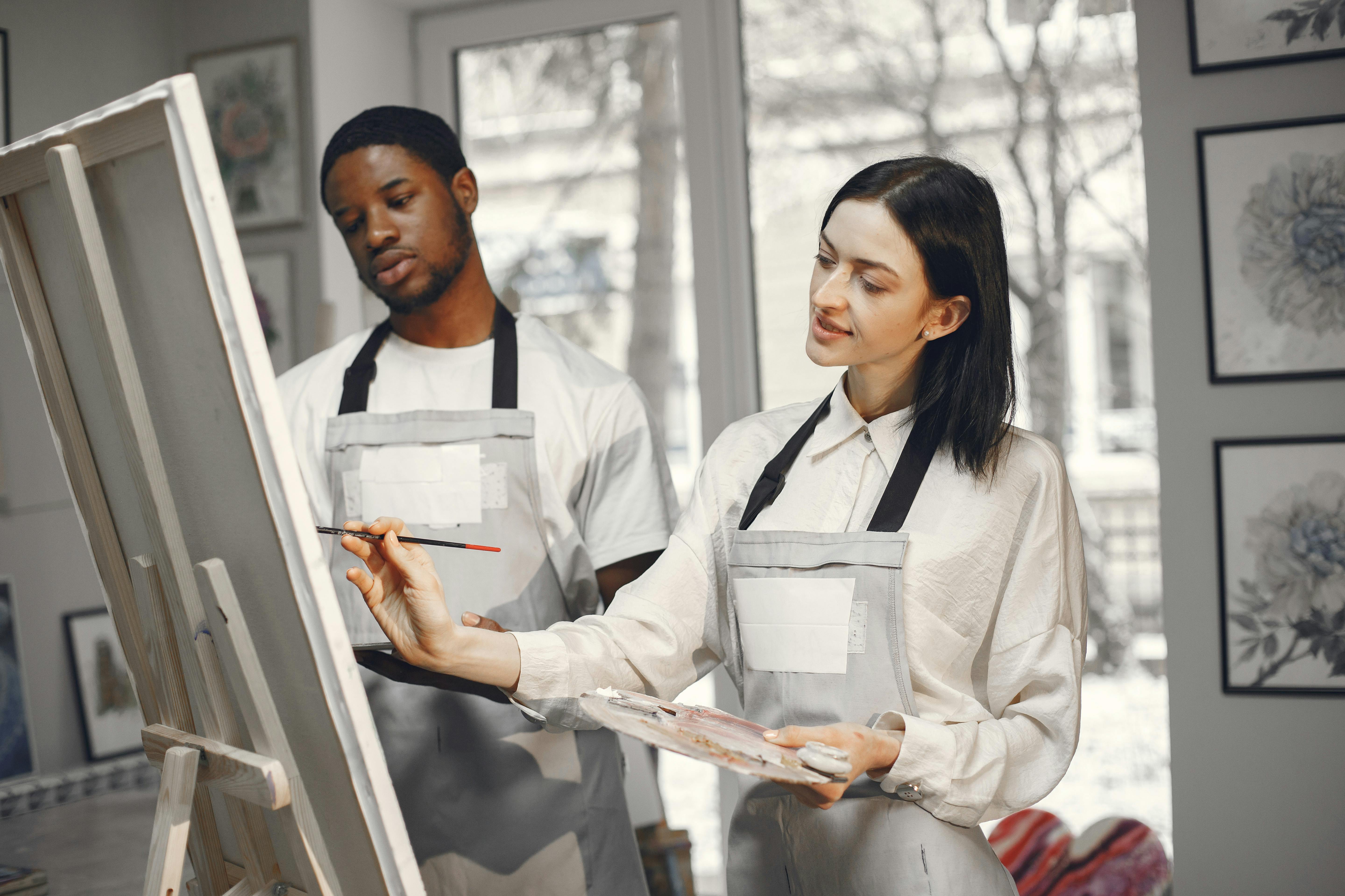 Man and Woman Painting Together · Free Stock Photo