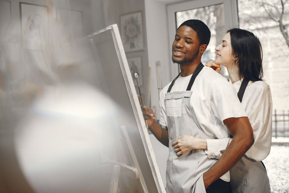 couple painting together at art studio - activities to do as a couple