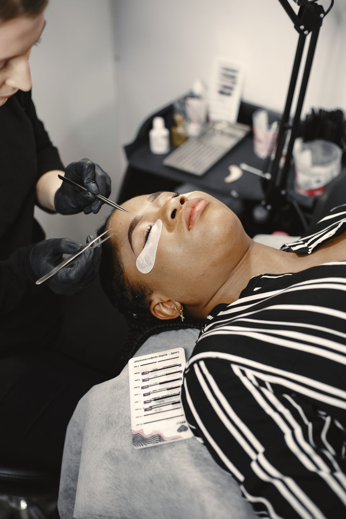 Professional eyelash extension treatment at a beauty salon