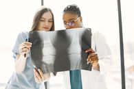 Two Doctors Examining an X-Ray Film