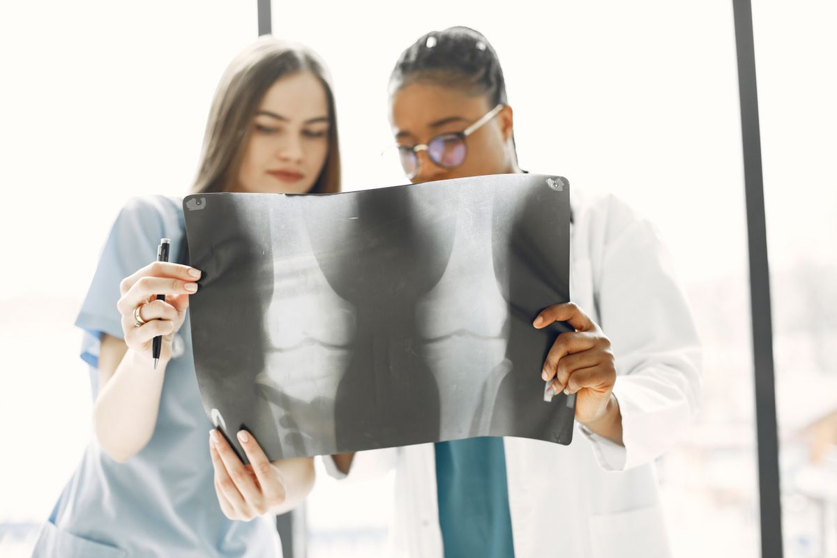 Healthcare professionals reviewing an X-ray in a bright clinic