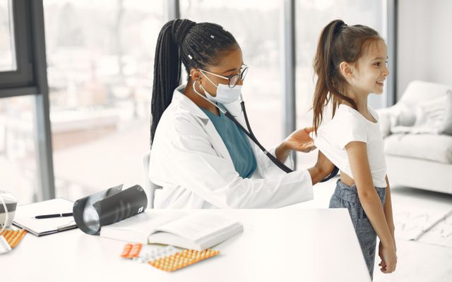 A doctor with a young patient at an appointment