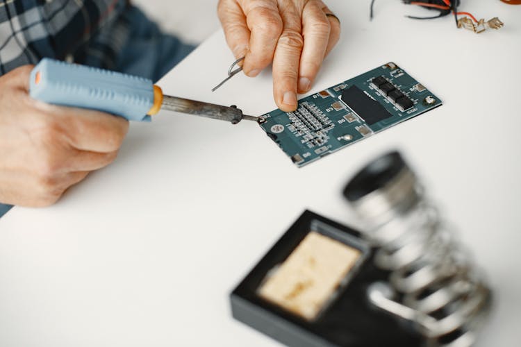 Close-up Of A Man Soldering 