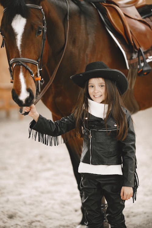 Close-Up Shot of a Girl near a Horse