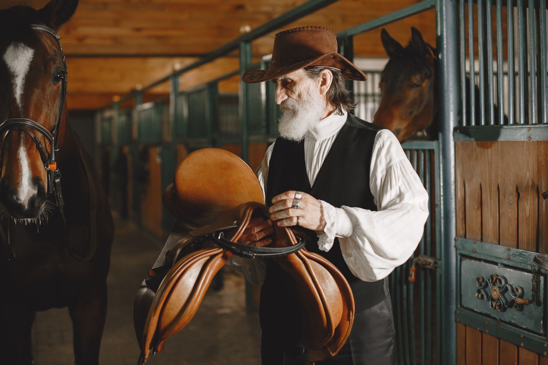 A focused bettor comparing horse racing odds on a smartphone beside racing form sheets