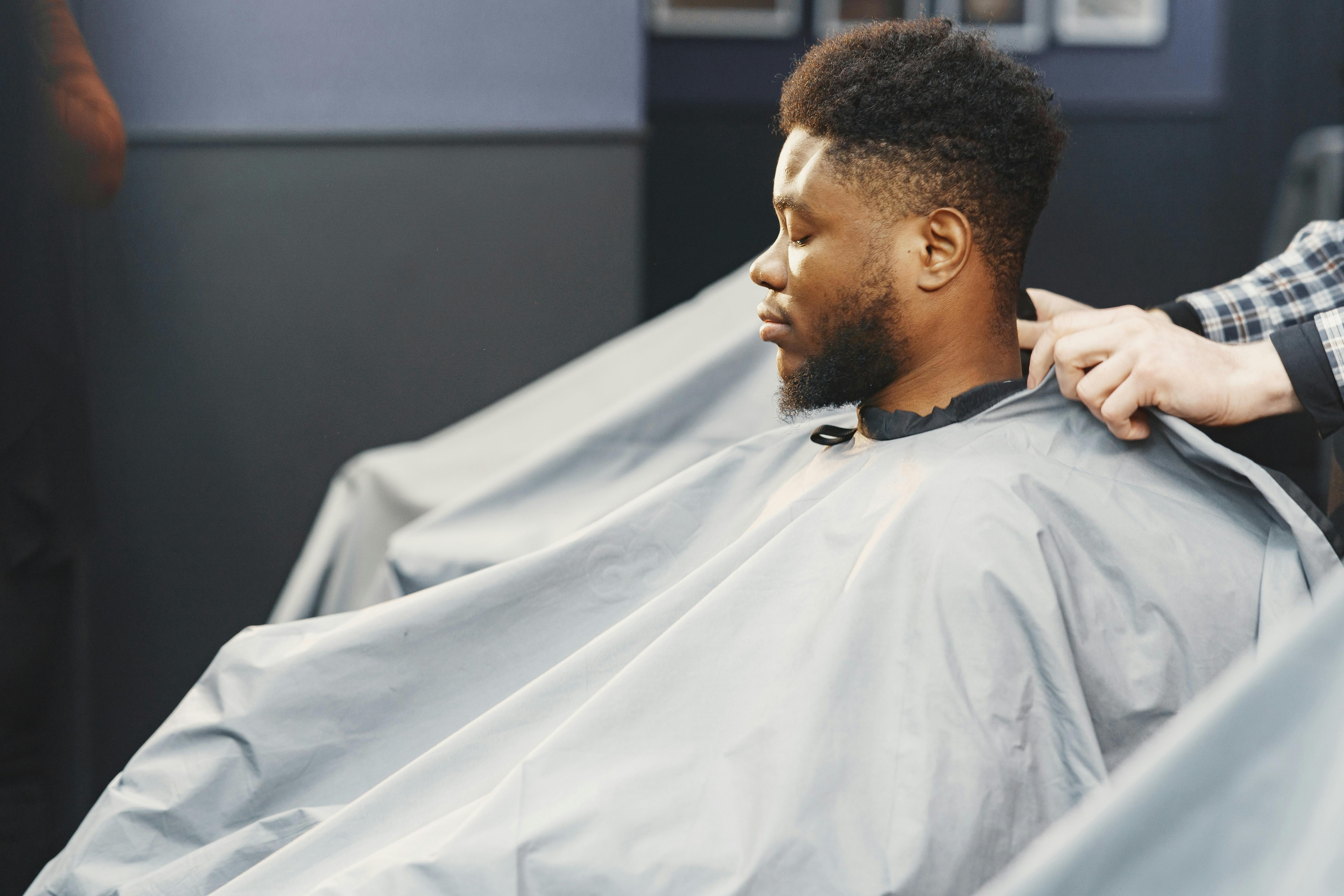 Man Getting His Hair Cut at a Barber Shop · Free Stock Photo