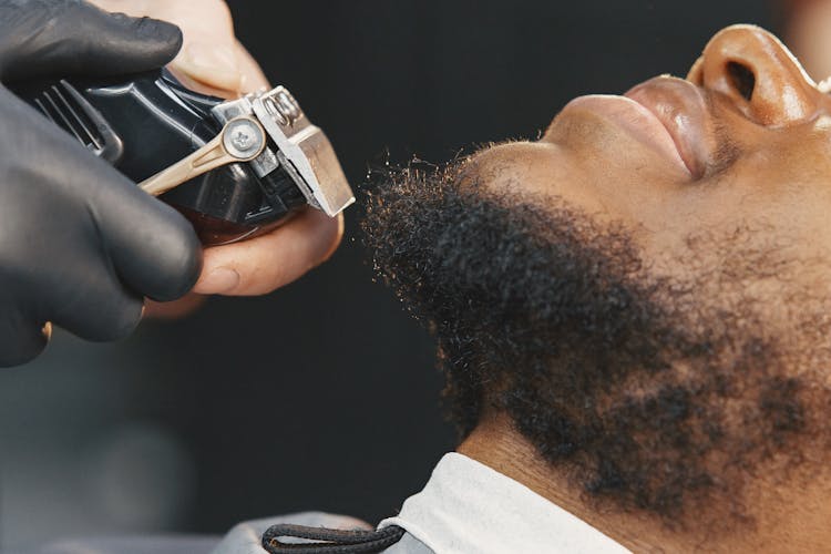 Barber Trimming Beard