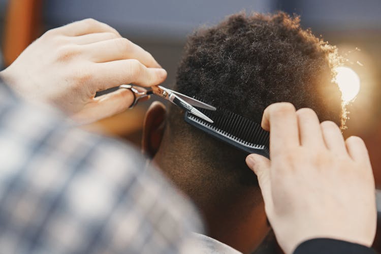 Man Getting His Hair Trimmed