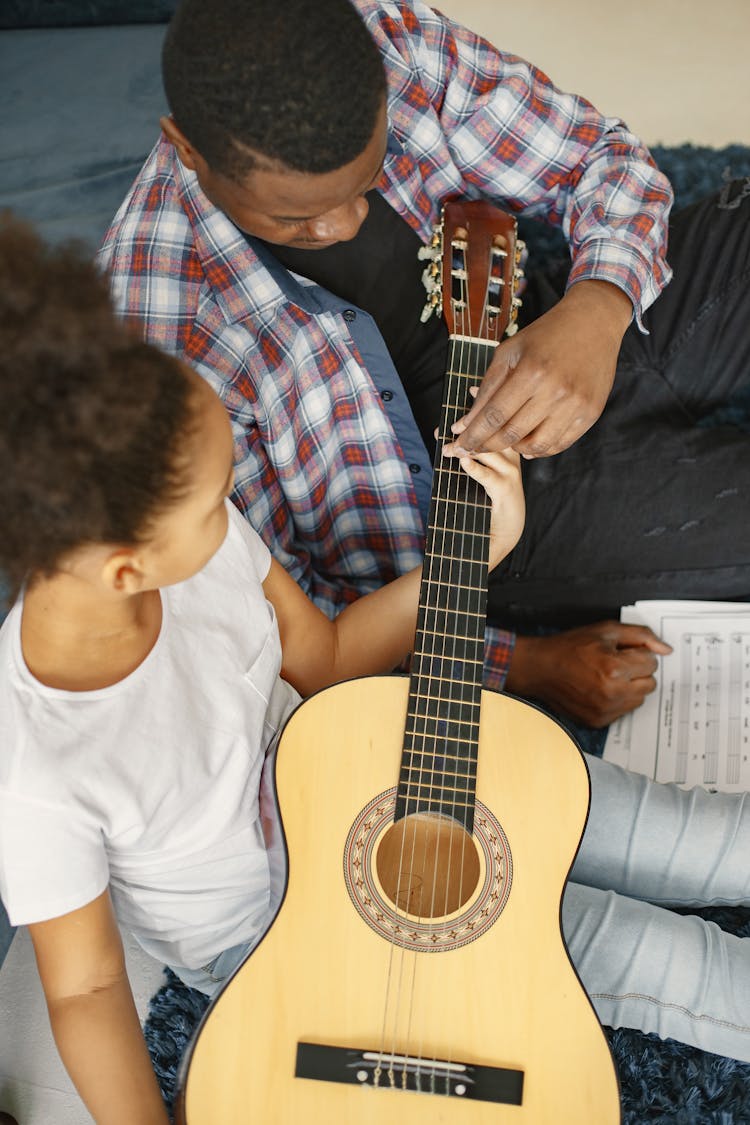 Father And Daughter With Guitar