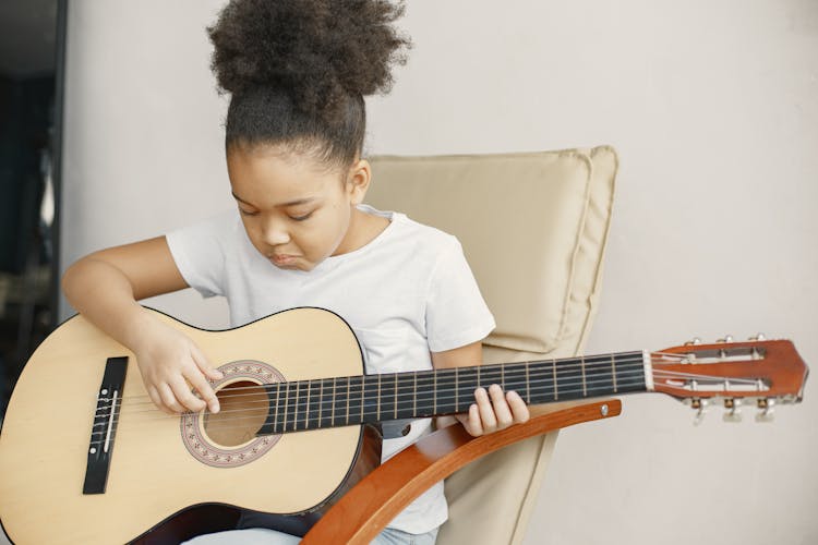 Girl Playing The Guitar