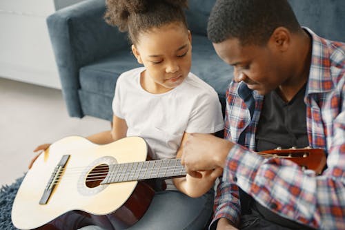 Father and Daughter with Guitar