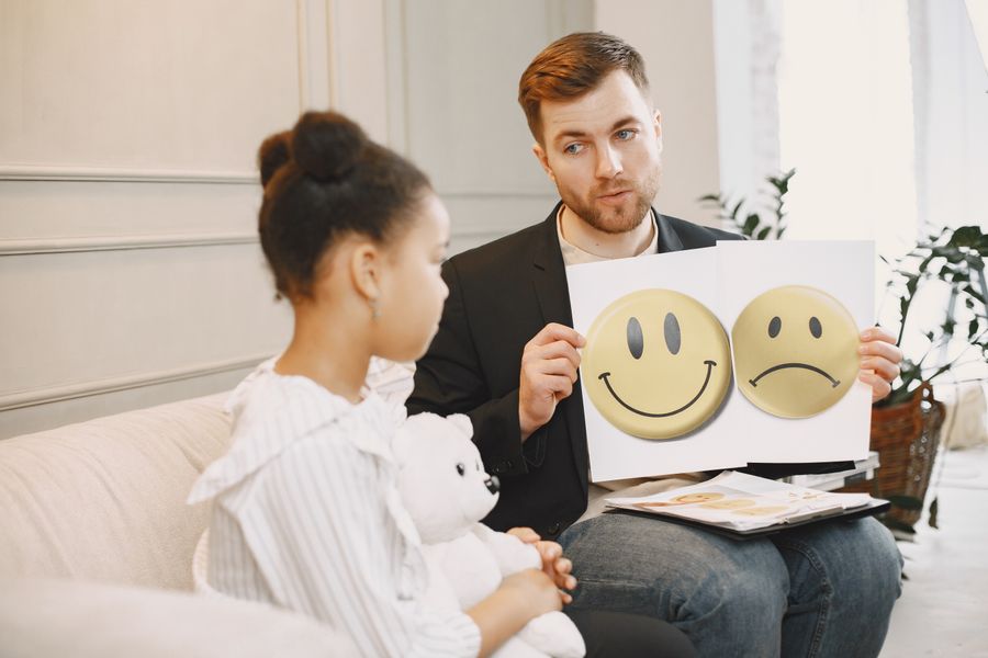 Therapist helping a child with communication skills